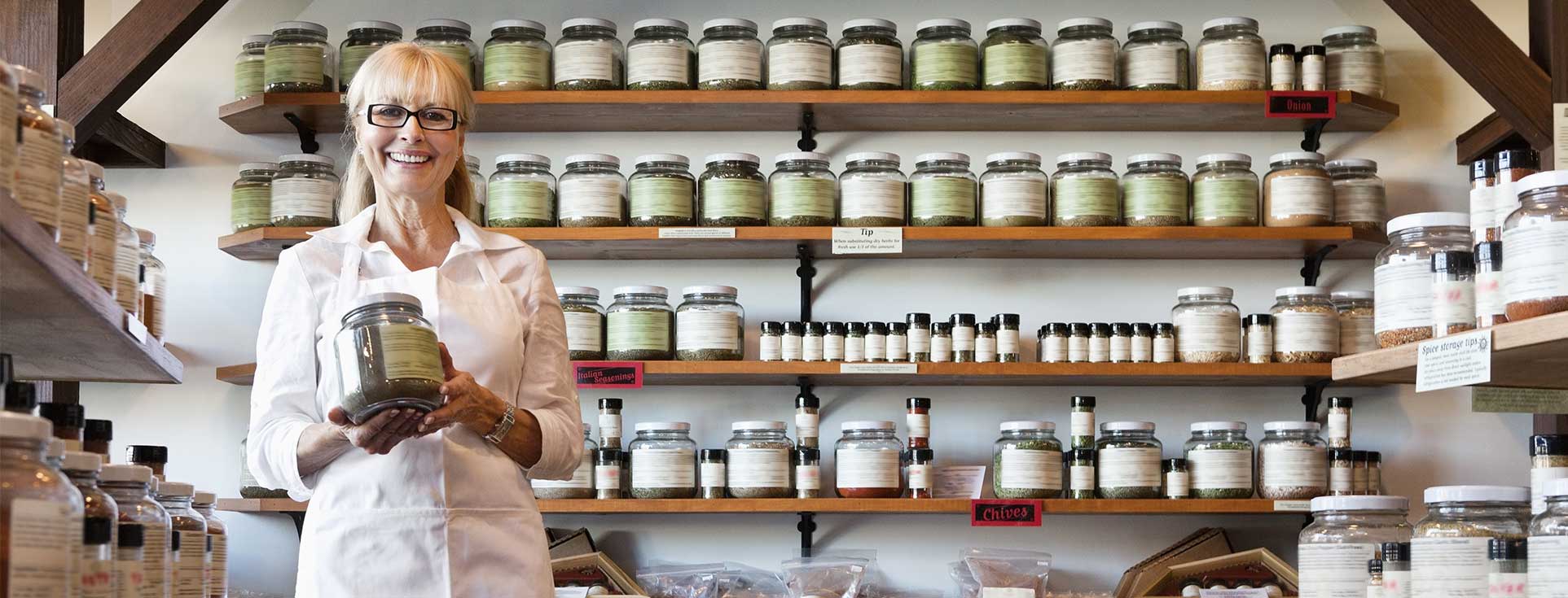 Business owner smiling with products