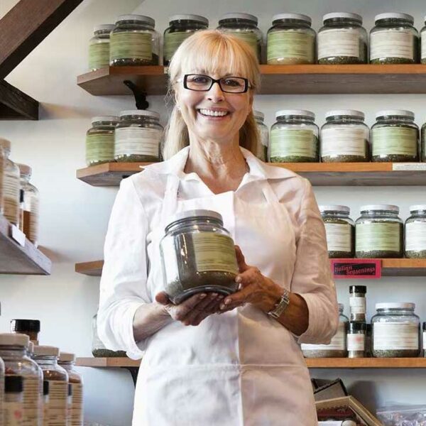 Business owner smiling with products